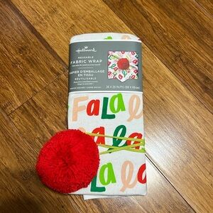 Hallmark Reusable Fabric Wrap, Fala la la! Design on a white tea towel